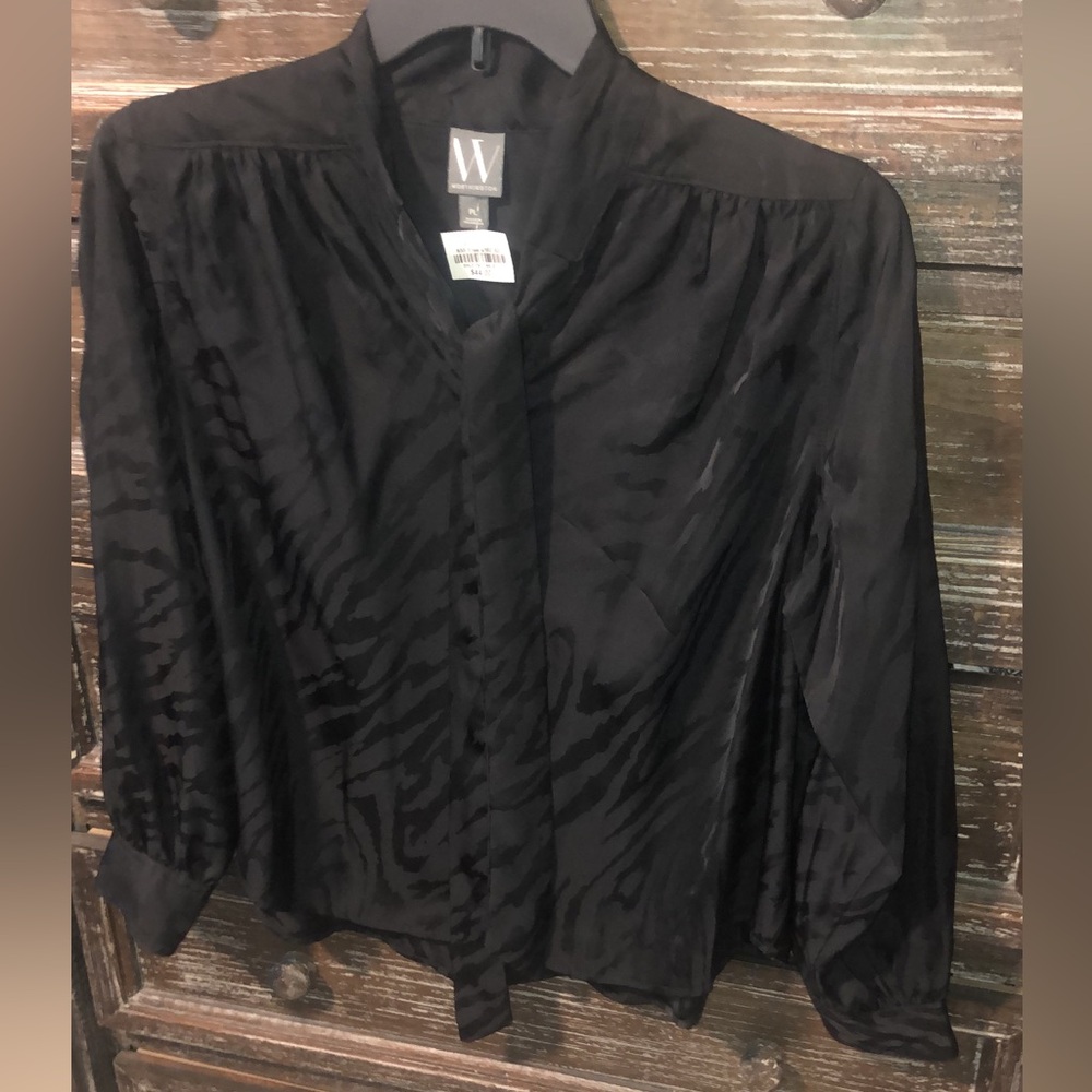 Woman’s brand new blouse size large